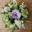 634 Zijden bloemstuk in lila schaal